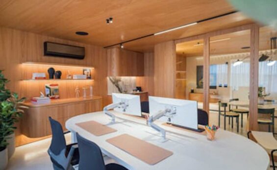 Blog Modern office with built-in wooden shelving and workspace